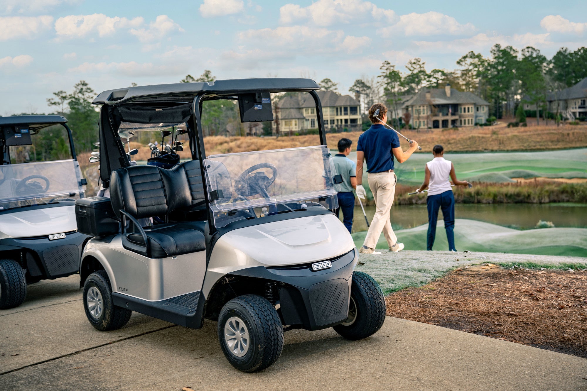 EZGo golf buggy, powered by a lithium battery fitted with a roof and screen